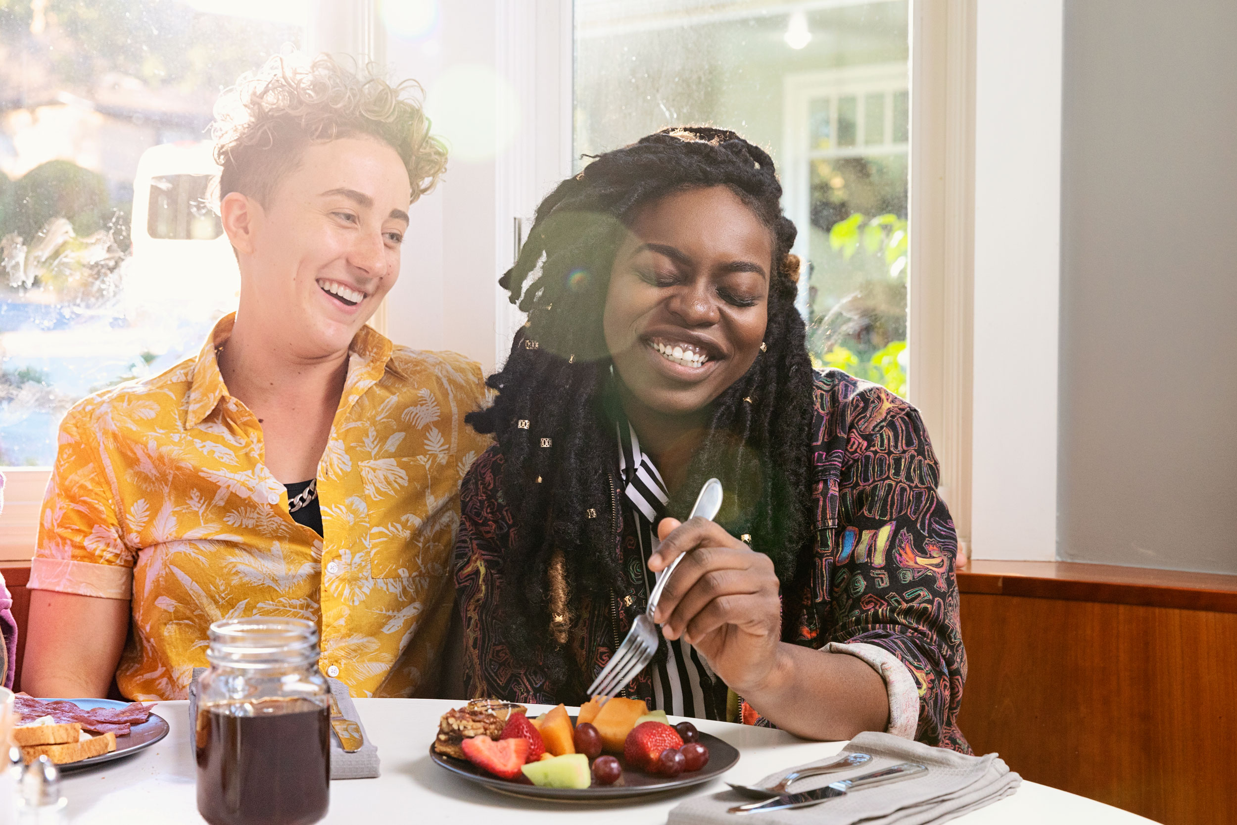 LGBTQ youth laughing at the kitchen table - Kim Genevieve Los Angeles Lifestyle Photographer